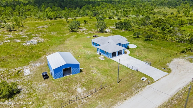 156 Puddle Duck Ln, Grant-Valkaria, FL 32909 - aerial view of property and surrounding area featuring a forest
