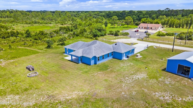 156 Puddle Duck Ln, Grant-Valkaria, FL 32909 - aerial view of property and surrounding area featuring a heavily wooded area