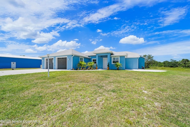 156 Puddle Duck Ln, Grant-Valkaria, FL 32909 - ranch-style house with driveway, a front yard, and stucco siding