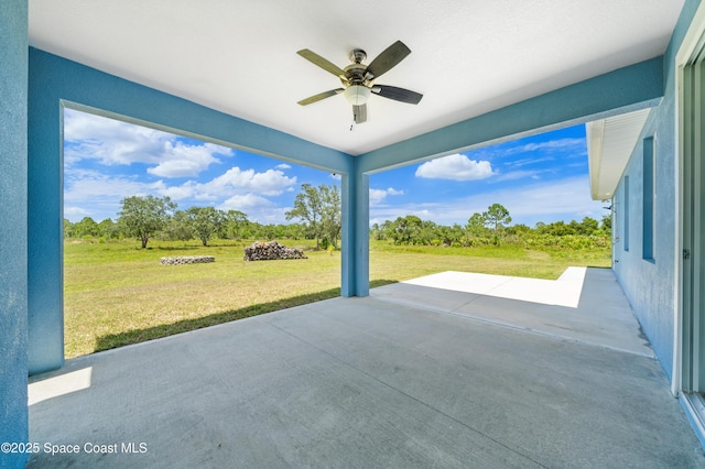 156 Puddle Duck Ln, Grant-Valkaria, FL 32909 - view of patio / terrace featuring a ceiling fan and view of scattered trees