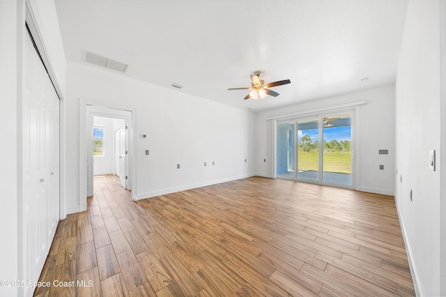 156 Puddle Duck Ln, Grant-Valkaria, FL 32909 - spare room with healthy amount of natural light, a ceiling fan, and light wood finished floors