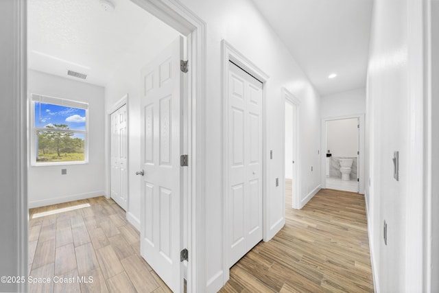 156 Puddle Duck Ln, Grant-Valkaria, FL 32909 - hall with light wood-style floors and recessed lighting