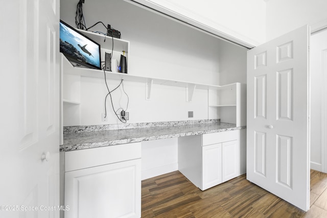 156 Puddle Duck Ln, Grant-Valkaria, FL 32909 - kitchen featuring open shelves, built in desk, dark wood-style flooring, white cabinetry, and light stone countertops