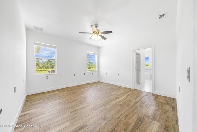 156 Puddle Duck Ln, Grant-Valkaria, FL 32909 - unfurnished room featuring a ceiling fan, plenty of natural light, and light wood-style floors
