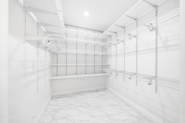 156 Puddle Duck Ln, Grant-Valkaria, FL 32909 - spacious closet featuring marble look tiles