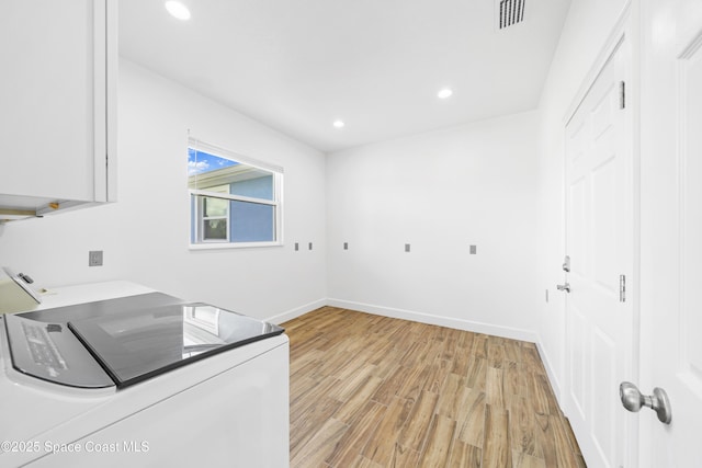 156 Puddle Duck Ln, Grant-Valkaria, FL 32909 - laundry room with washing machine and clothes dryer, light wood-style floors, recessed lighting, and cabinet space