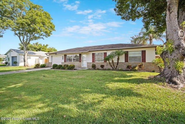 3664 Longbow Rd, Cocoa, FL 32926 - ranch-style house featuring an attached garage, concrete driveway, a front yard, and stucco siding