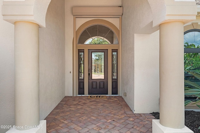 7987 Bradwick Way, Melbourne, FL 32940 - view of exterior entry with stucco siding