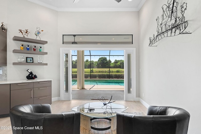 7987 Bradwick Way, Melbourne, FL 32940 - living area with light wood-style flooring and crown molding