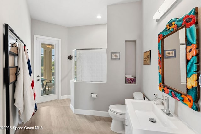 7987 Bradwick Way, Melbourne, FL 32940 - bathroom featuring vanity, wood finished floors, and recessed lighting