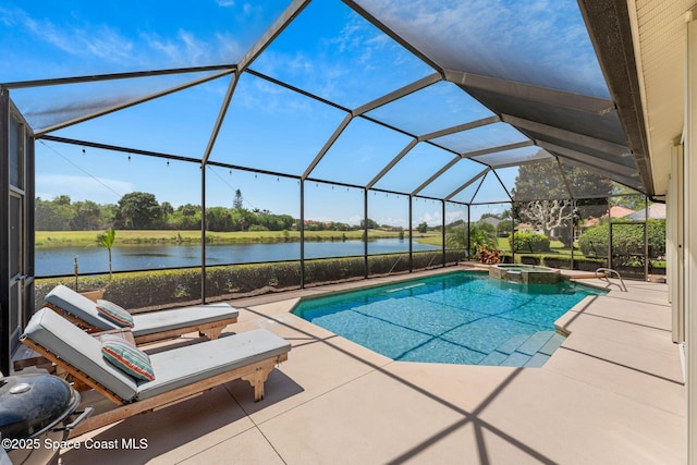 7987 Bradwick Way, Melbourne, FL 32940 - view of pool featuring a patio area, a water view, a pool with connected hot tub, and glass enclosure
