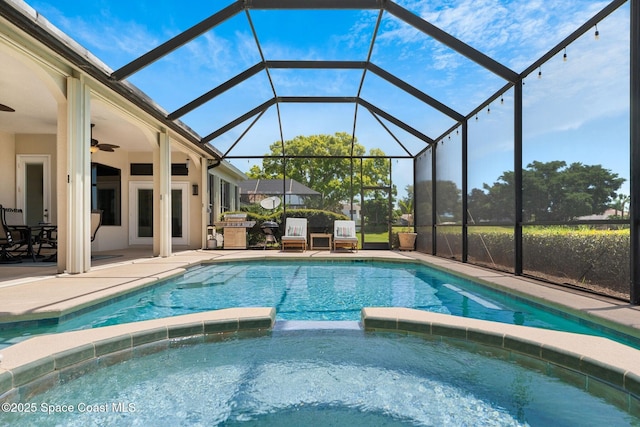 7987 Bradwick Way, Melbourne, FL 32940 - view of swimming pool featuring a pool with connected hot tub, a patio area, a ceiling fan, a lanai, and area for grilling