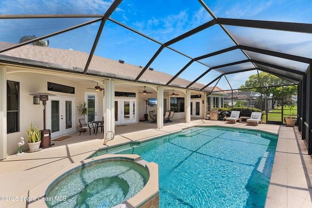 7987 Bradwick Way, Melbourne, FL 32940 - view of swimming pool featuring french doors, ceiling fan, a pool with connected hot tub, a patio area, and a lanai