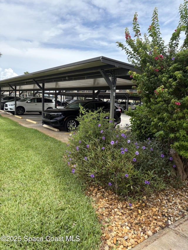 520 Palm Springs Blvd Unit 102, Indian Harbour Beach, FL 32937 - view of covered parking lot