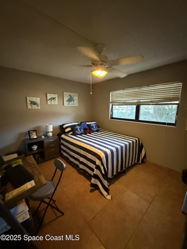 520 Palm Springs Blvd Unit 102, Indian Harbour Beach, FL 32937 - bedroom featuring light tile patterned flooring and a ceiling fan