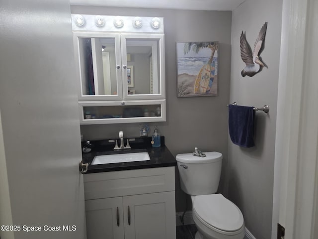 520 Palm Springs Blvd Unit 102, Indian Harbour Beach, FL 32937 - bathroom with toilet and vanity