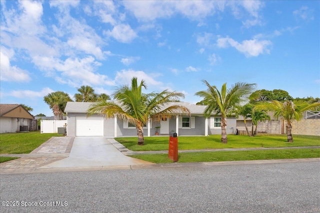 955 Bartlett Ln, Rockledge, FL 32955 - single story home featuring concrete driveway, an attached garage, and a gate