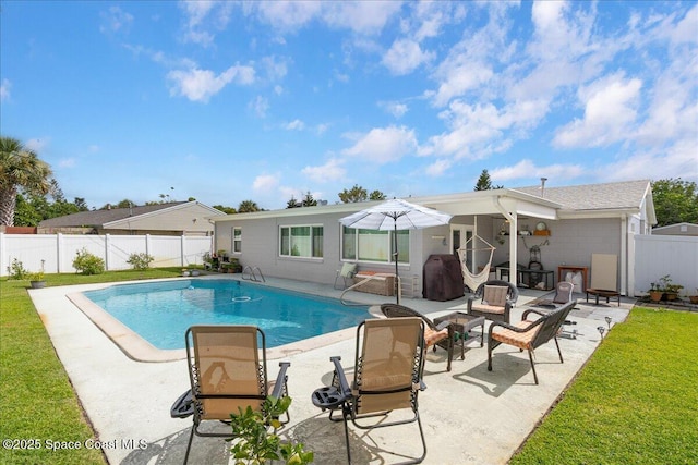 955 Bartlett Ln, Rockledge, FL 32955 - view of pool featuring a patio area, a fenced backyard, and an outdoor fire pit