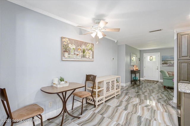 955 Bartlett Ln, Rockledge, FL 32955 - dining area featuring a ceiling fan and crown molding