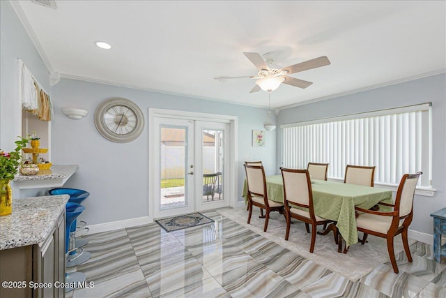 955 Bartlett Ln, Rockledge, FL 32955 - dining space featuring ornamental molding, french doors, and a ceiling fan