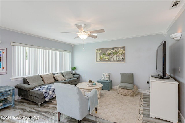 955 Bartlett Ln, Rockledge, FL 32955 - living area featuring a ceiling fan and crown molding