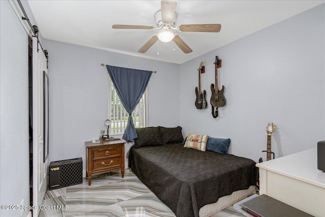 955 Bartlett Ln, Rockledge, FL 32955 - bedroom with a barn door and ceiling fan