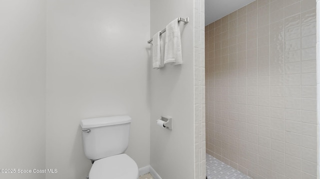 1734 Bluebird Ct, Melbourne, FL 32935 - full bathroom featuring a tile shower and toilet