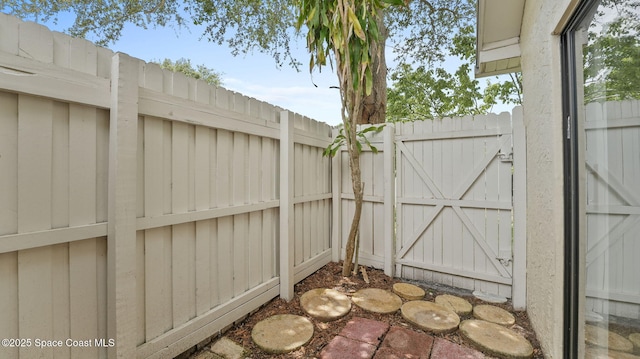 1734 Bluebird Ct, Melbourne, FL 32935 - view of patio / terrace with a gate