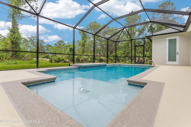 8025 Babcock St SE, Grant-Valkaria, FL 32909 - swimming pool with a hot tub, a patio, and glass enclosure