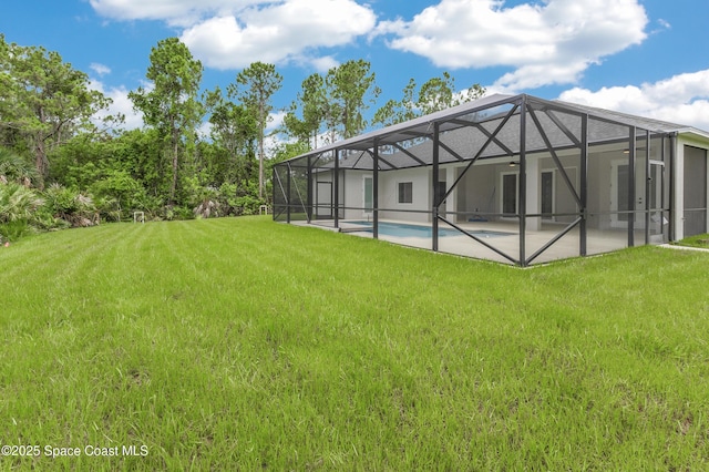 8025 Babcock St SE, Grant-Valkaria, FL 32909 - back of house with a yard, a patio, an outdoor pool, and a lanai