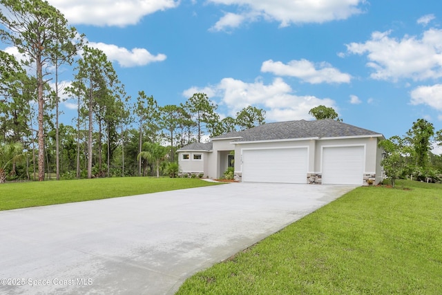 8025 Babcock St SE, Grant-Valkaria, FL 32909 - view of front facade with an attached garage, stucco siding, driveway, a front yard, and stone siding