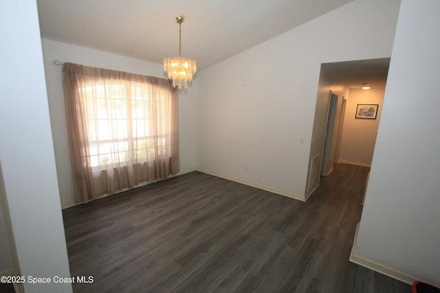 1366 17th Pl SW, Vero Beach, FL 32962 - empty room featuring dark wood-style floors and a chandelier