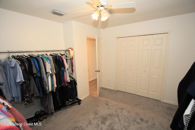 1366 17th Pl SW, Vero Beach, FL 32962 - walk in closet featuring a ceiling fan and carpet floors