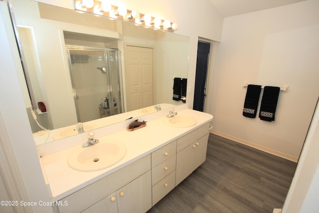 1366 17th Pl SW, Vero Beach, FL 32962 - full bath with double vanity, a shower stall, and wood finished floors