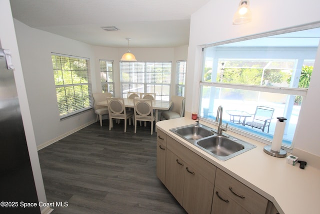 1366 17th Pl SW, Vero Beach, FL 32962 - kitchen featuring light countertops, dark wood-style floors, and healthy amount of natural light