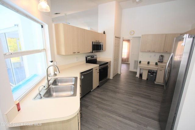1366 17th Pl SW, Vero Beach, FL 32962 - kitchen featuring stainless steel appliances, light brown cabinetry, light countertops, dark wood finished floors, and a towering ceiling
