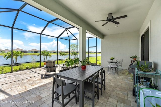 1052 Great Belt Cir, Melbourne, FL 32940 - view of patio / terrace with a water view, outdoor dining space, and a lanai