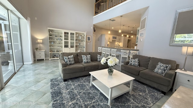 210 Pelican Dr, Melbourne Beach, FL 32951 - living area featuring a towering ceiling and light tile patterned flooring