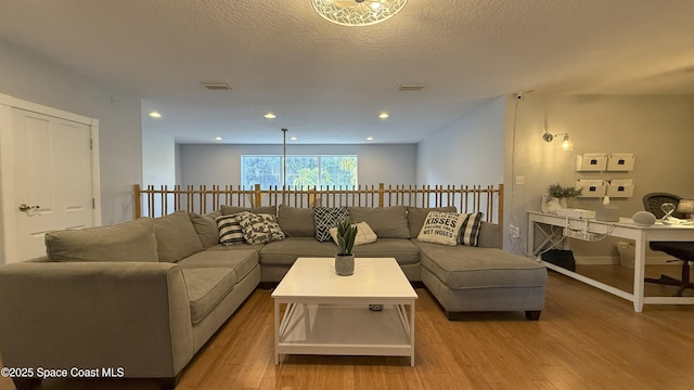 210 Pelican Dr, Melbourne Beach, FL 32951 - living room featuring light wood-style flooring