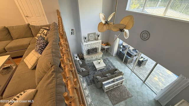 210 Pelican Dr, Melbourne Beach, FL 32951 - tiled living area with a fireplace