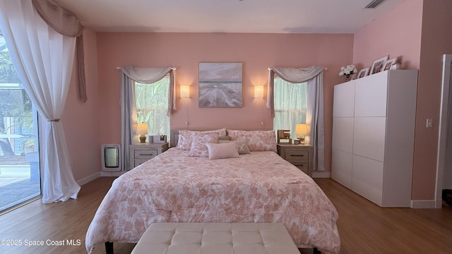 210 Pelican Dr, Melbourne Beach, FL 32951 - bedroom with light wood finished floors
