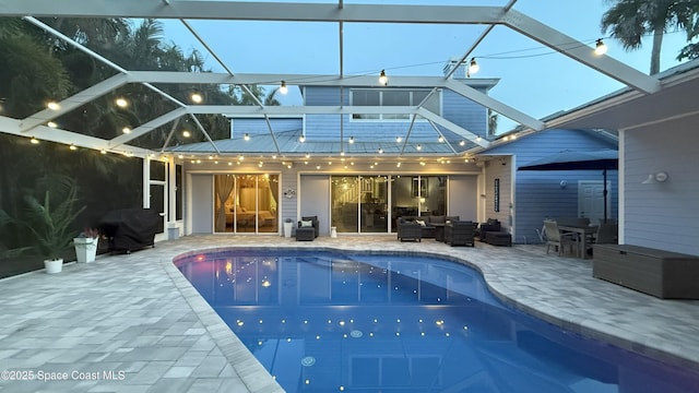 210 Pelican Dr, Melbourne Beach, FL 32951 - rear view of property with an outdoor hangout area, a patio, an outdoor pool, and a lanai