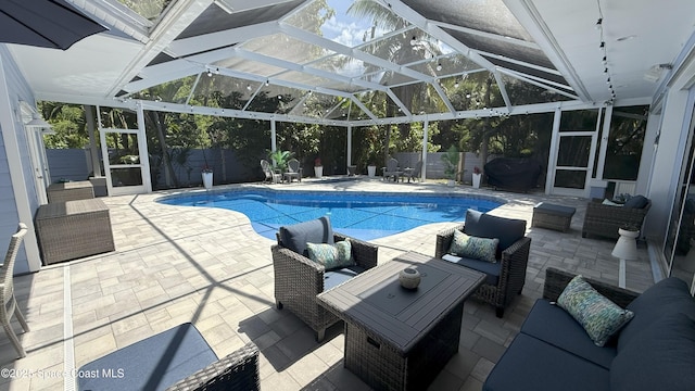 210 Pelican Dr, Melbourne Beach, FL 32951 - view of pool featuring outdoor lounge area, a fenced backyard, a patio area, and a lanai