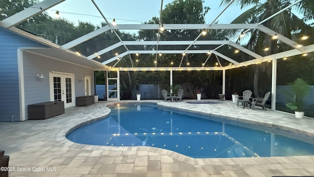 210 Pelican Dr, Melbourne Beach, FL 32951 - outdoor pool featuring french doors, a patio area, and a lanai