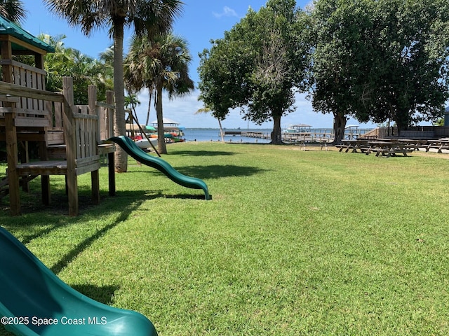 210 Pelican Dr, Melbourne Beach, FL 32951 - view of green lawn with a water view