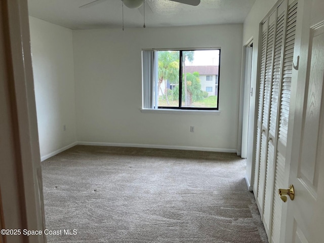 1515 Huntington Ln Unit 223, Rockledge, FL 32955 - unfurnished bedroom with carpet and a ceiling fan