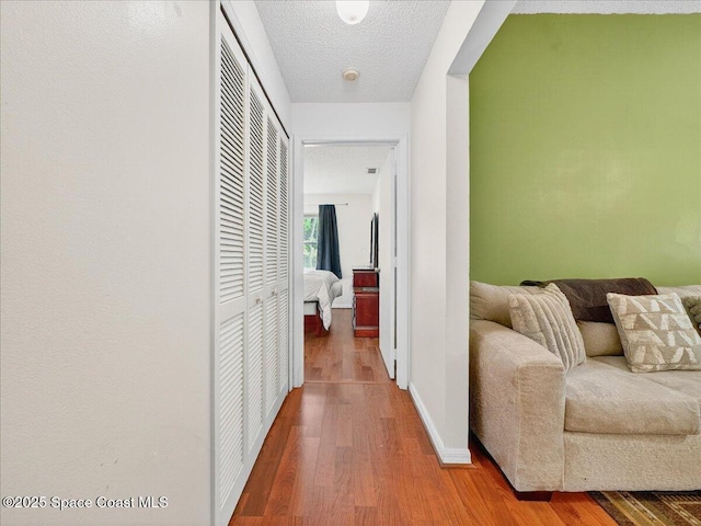 3116 Winchester Dr, Cocoa, FL 32926 - hallway featuring wood finished floors and a textured ceiling