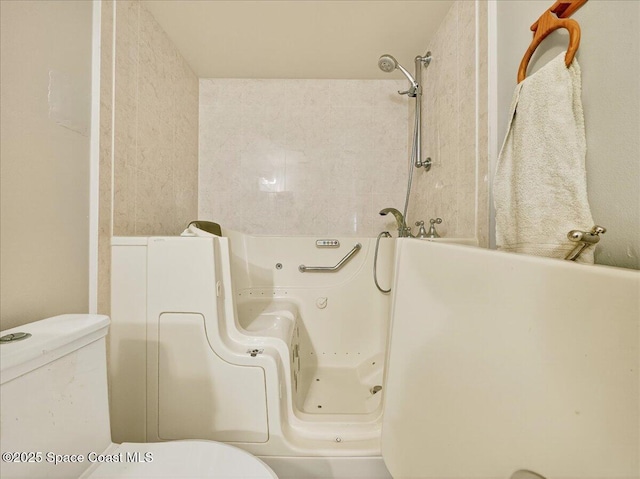 3116 Winchester Dr, Cocoa, FL 32926 - bathroom featuring toilet and a whirlpool tub