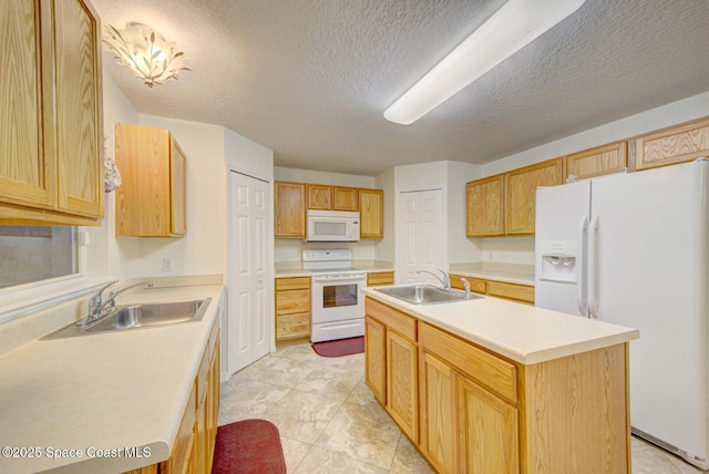 6065 Balboa St, Cocoa, FL 32927 - kitchen with white appliances, light countertops, a kitchen island with sink, a textured ceiling, and light tile patterned flooring