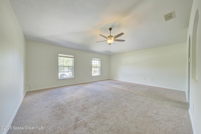 6065 Balboa St, Cocoa, FL 32927 - carpeted empty room featuring ceiling fan and a textured ceiling